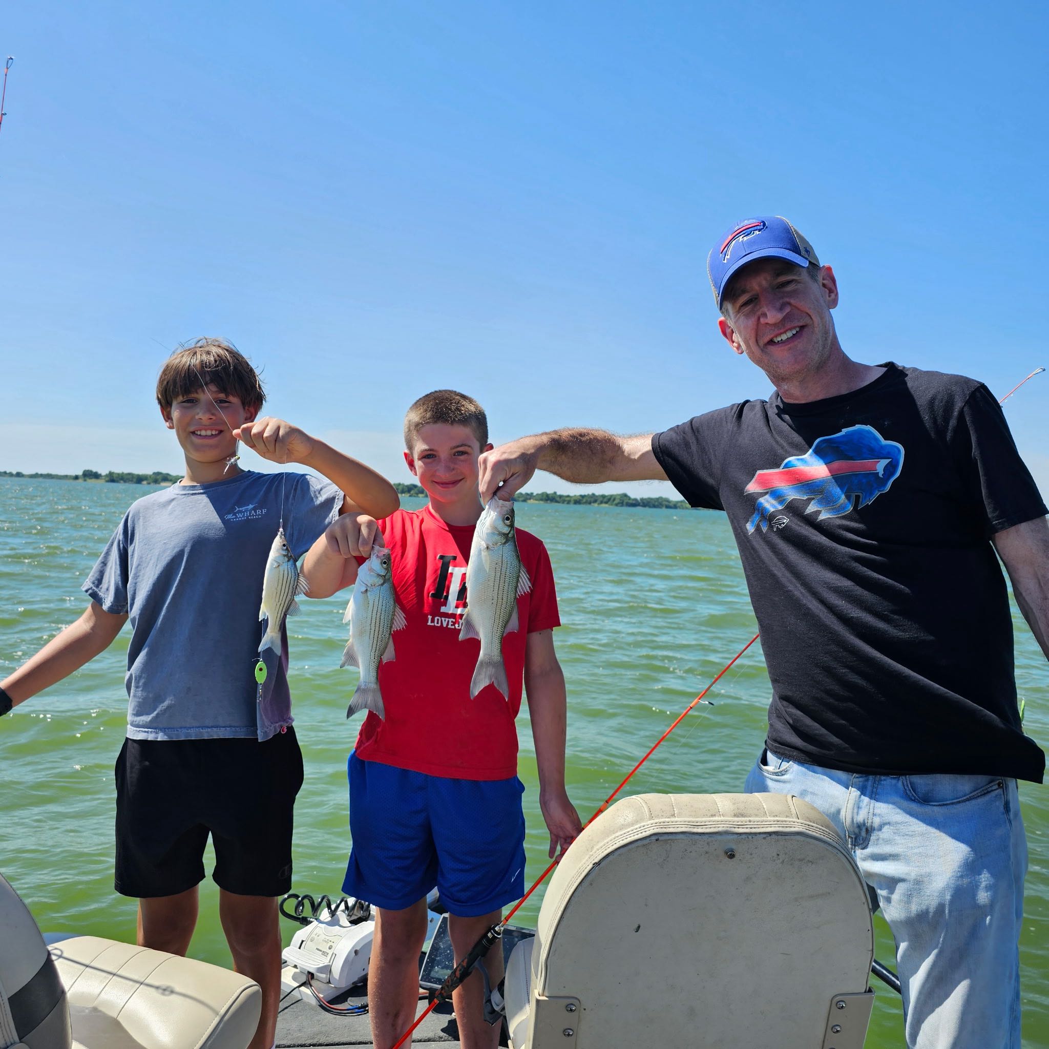 Successful fishing trip in Wylie TX with white bass and yellow bass catch displayed on boat