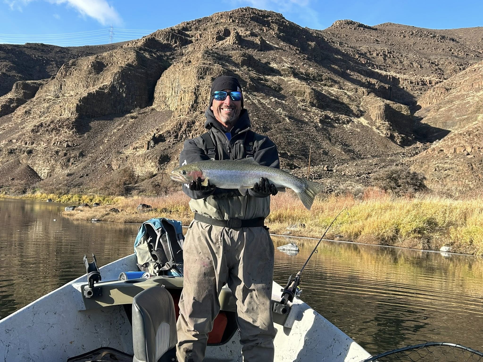 Angler fishing for a rainbow trout in Oregon
