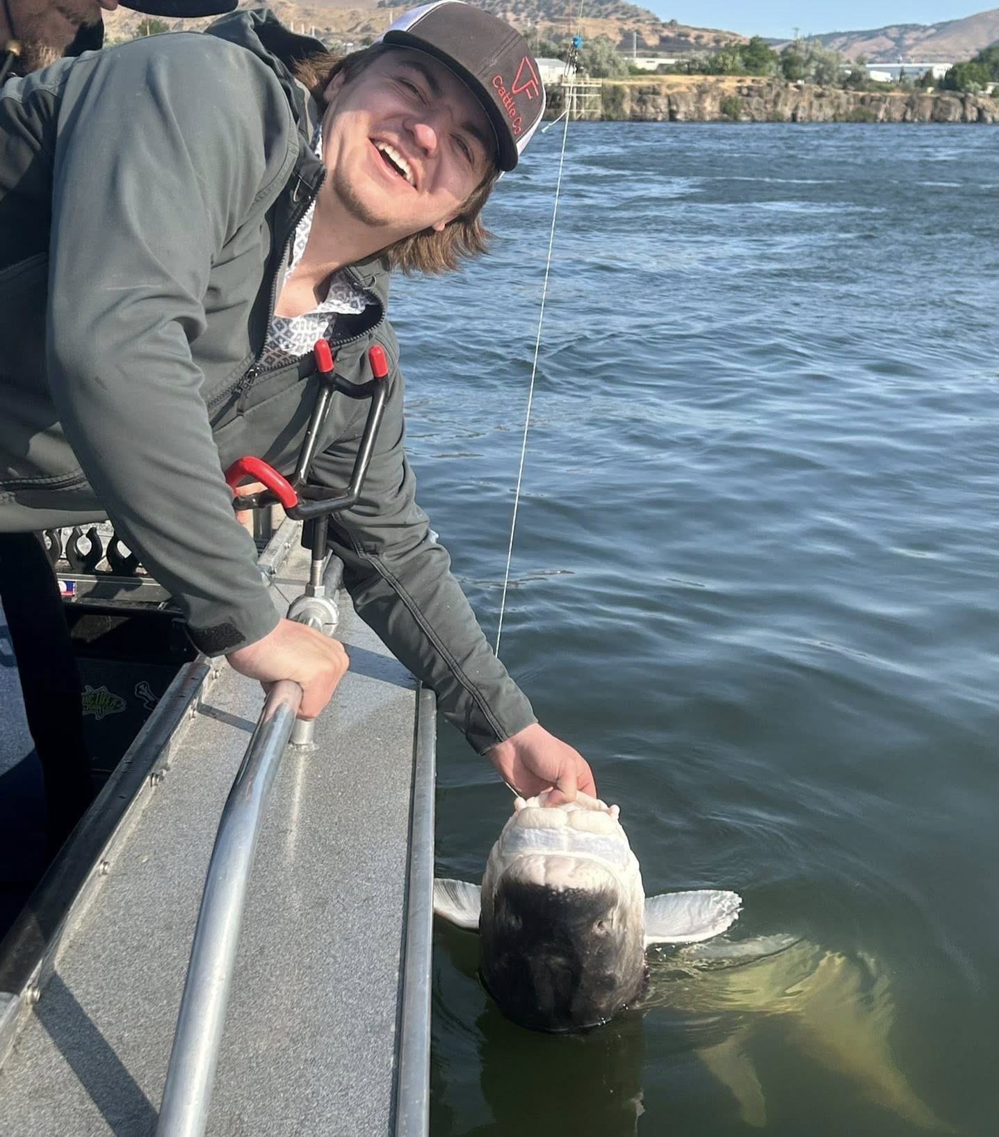 Private sturgeon fishing boat on Oregon river with Captain Kirk guiding beginners