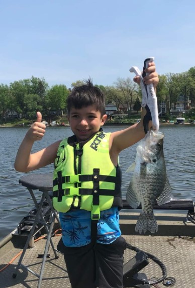 Angler with white crappie fish catch in Illinois