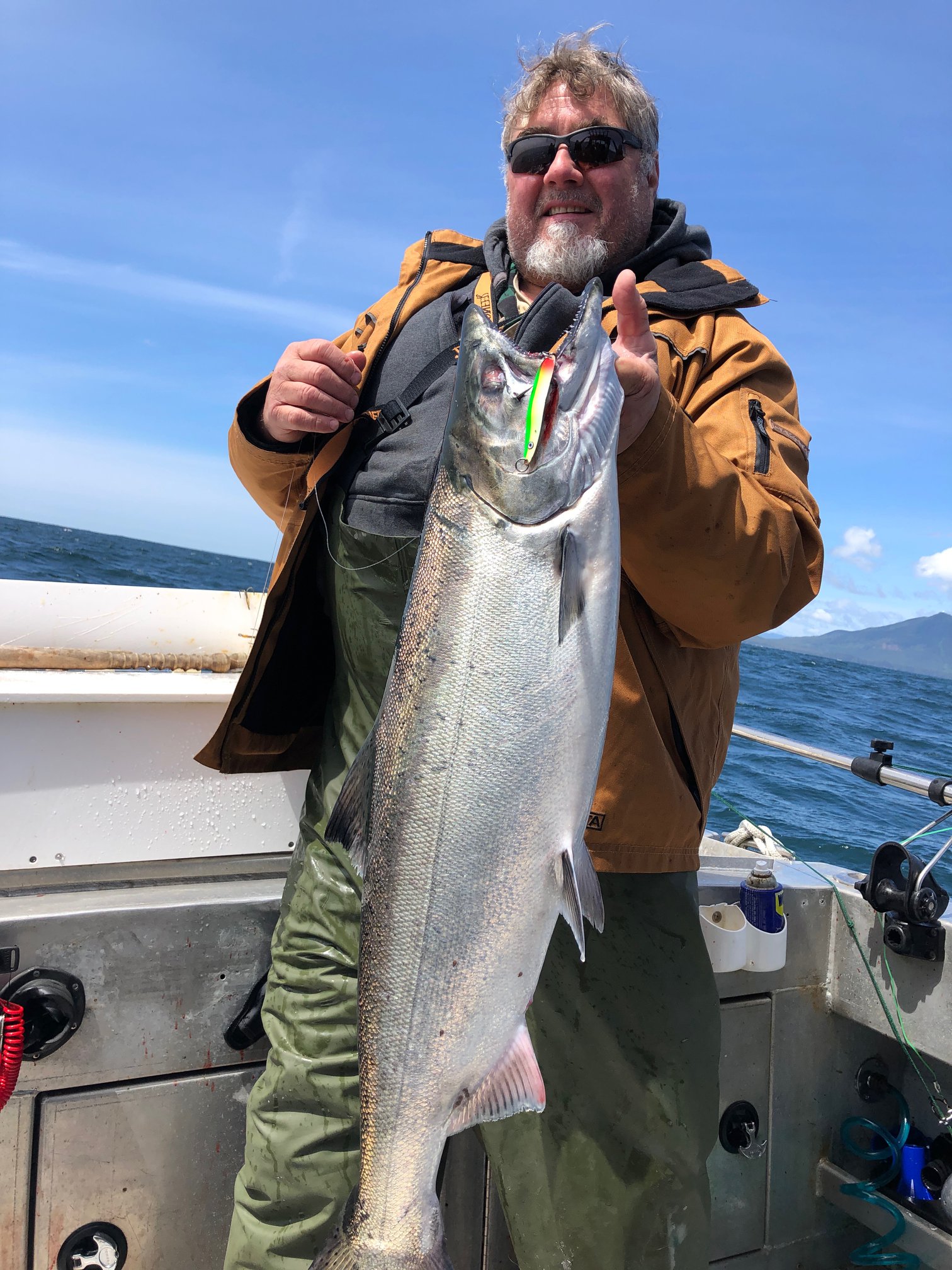 Angler holding a 31-inch fish in Ucluelet