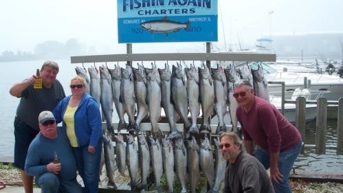5 people fishing at Kewaunee