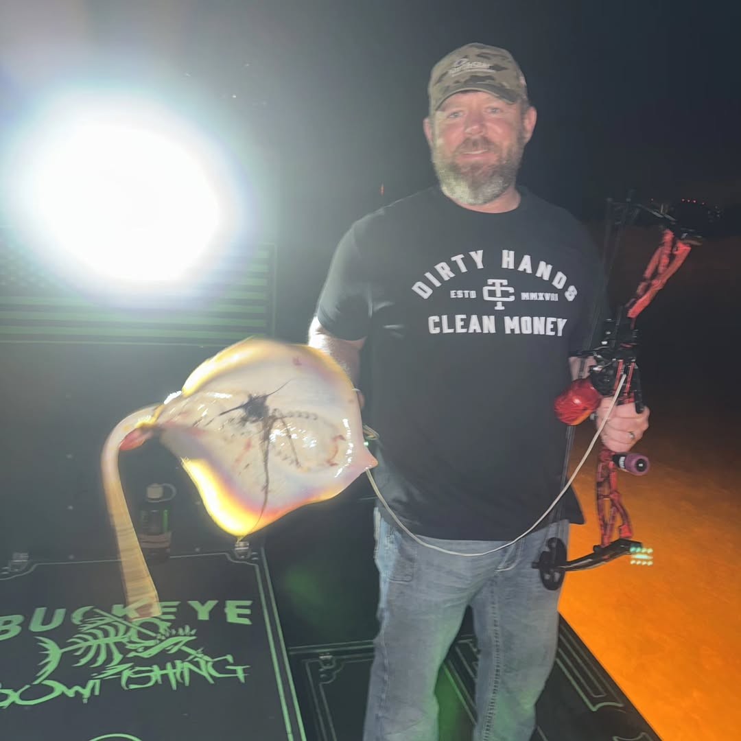 Bowfishing catch with large fish and compound bow setup in Ohio