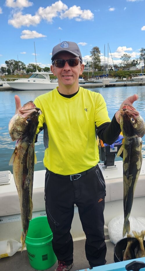 Two bass caught during fishing trip in Lorain OH displayed at marina