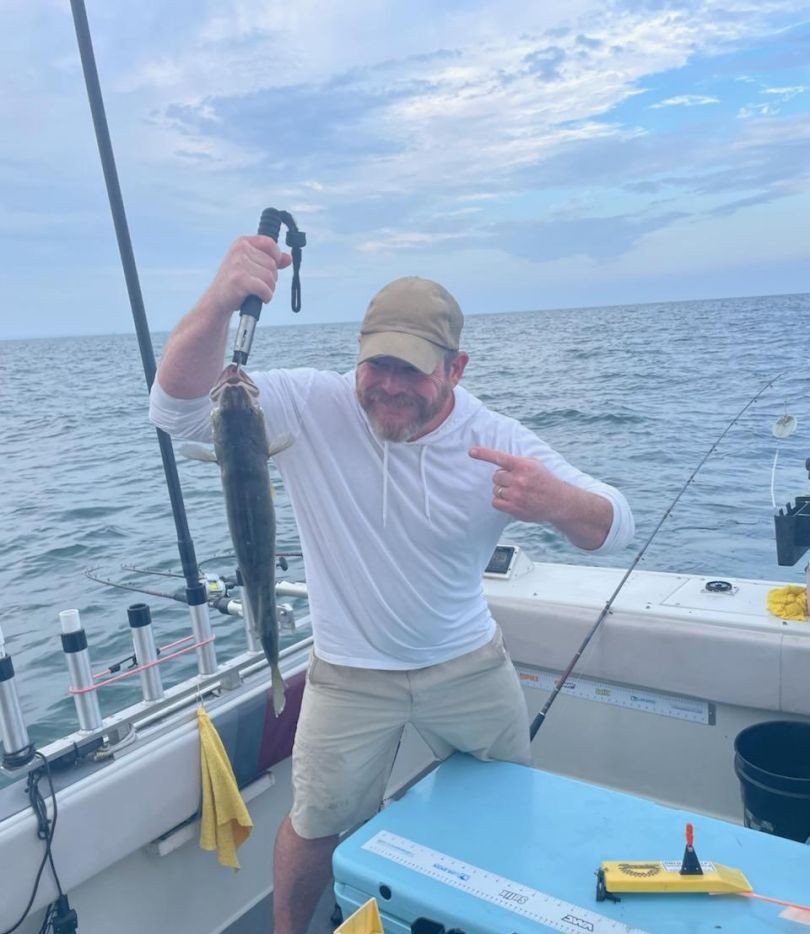 Fishing charter boat with fresh caught fish held up on Lake Erie near Lorain Ohio
