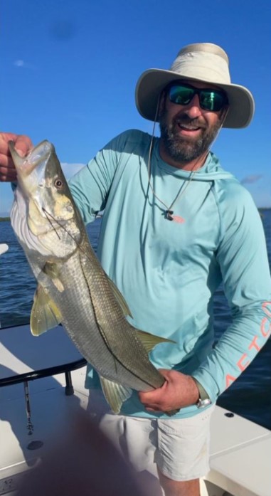Photo of a 20-inch Snook, a large fish, caught while fishing in Fort Myers.