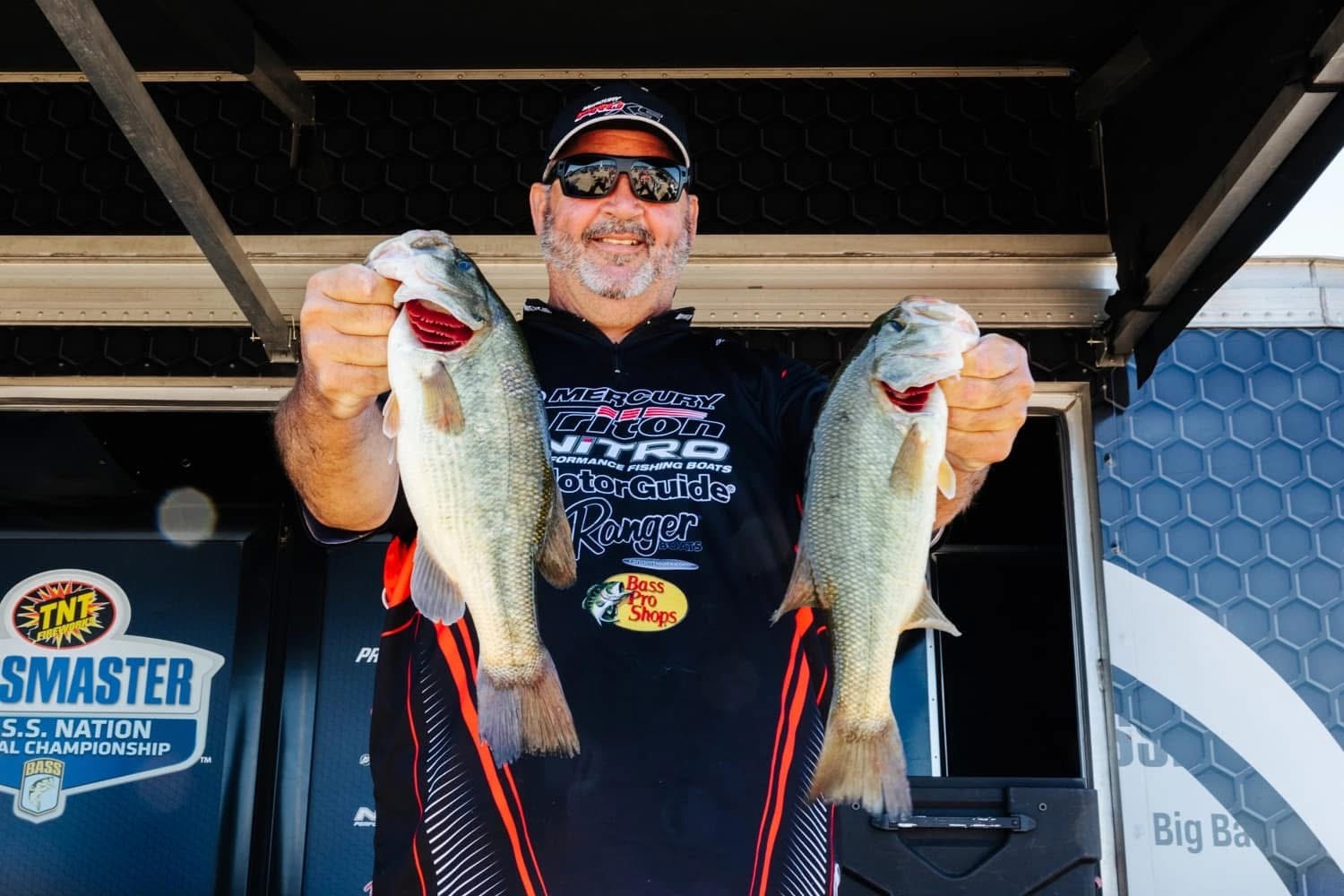 Professional bass fishing guide with anglers on Lake St. Clair corporate charter boat trip