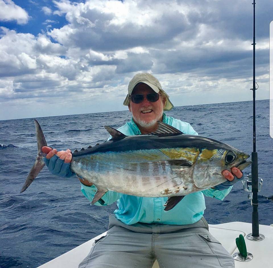 A fisherman catches a big blackfin tuna in Marathon, Florida