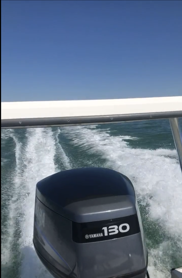 Yamaha 130 outboard motor creating white wake while fishing boat moves through green ocean waters in Islamorada FL