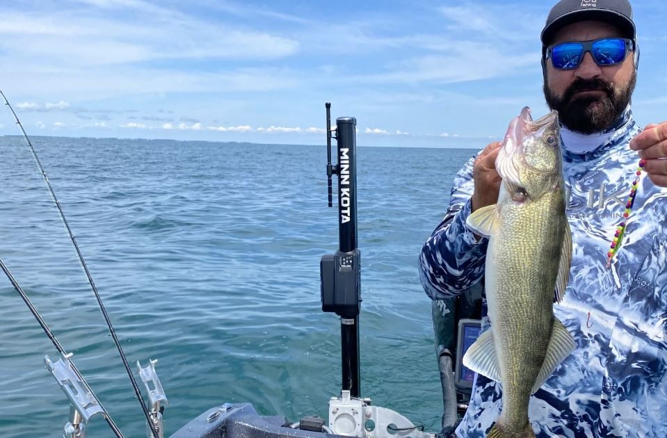 Angler holding a 17-inch fish in Port Clinton