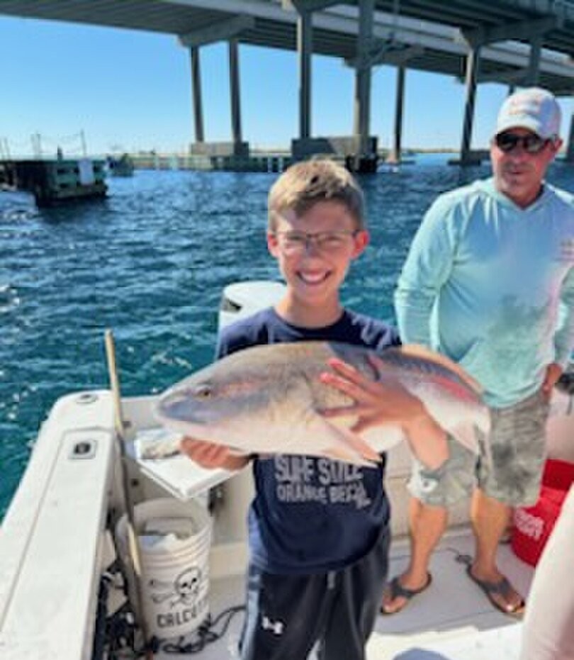 Large redfish caught while fishing in Shalimar FL waters near marina dock