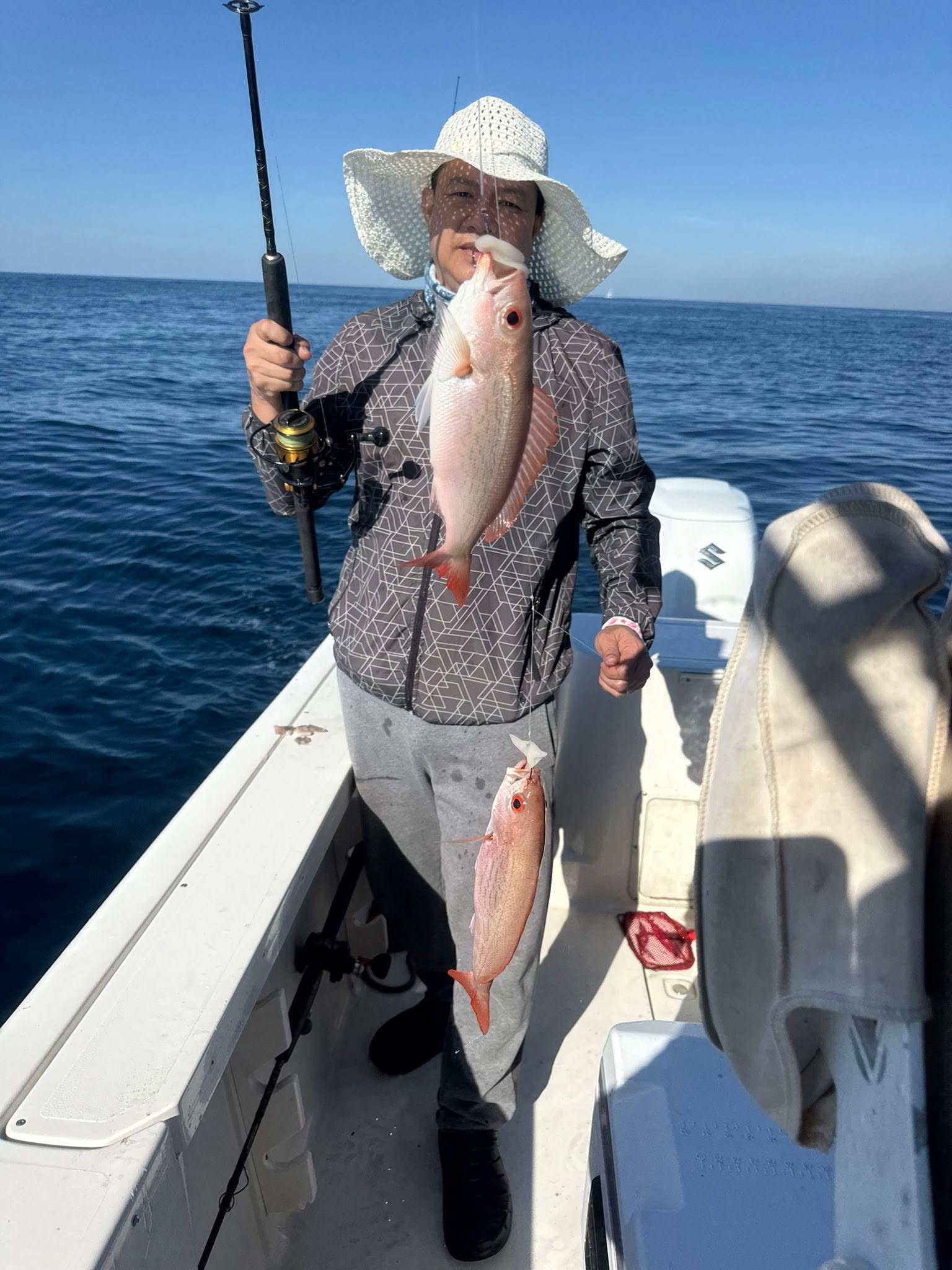 Two red snapper fish caught on fishing boat in Shalimar FL waters