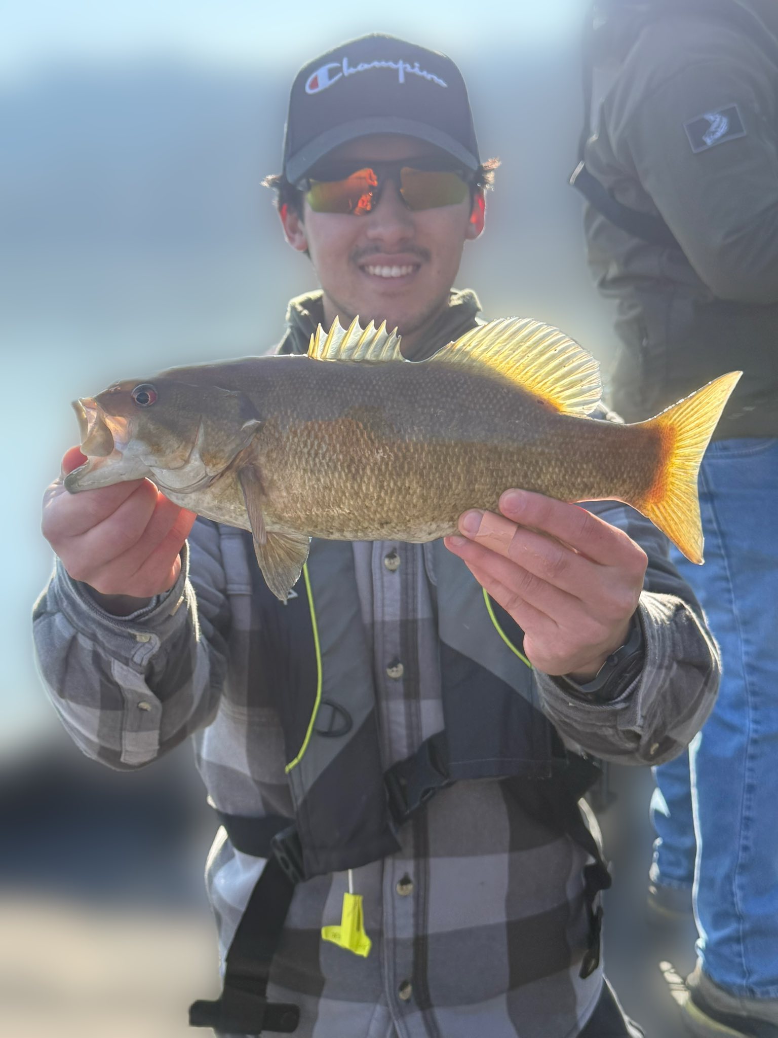 Freshly caught smallmouth bass being held up during fishing trip in Harrisburg PA