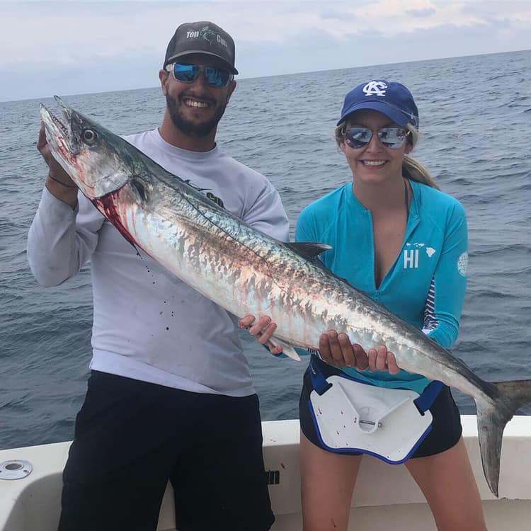 Two people enjoying fishing trip in Key Biscayne