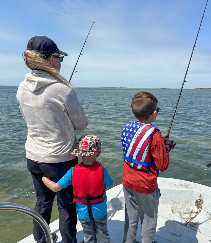 Fishing trip on boat in Aransas Pass TX with fishing rods and gear