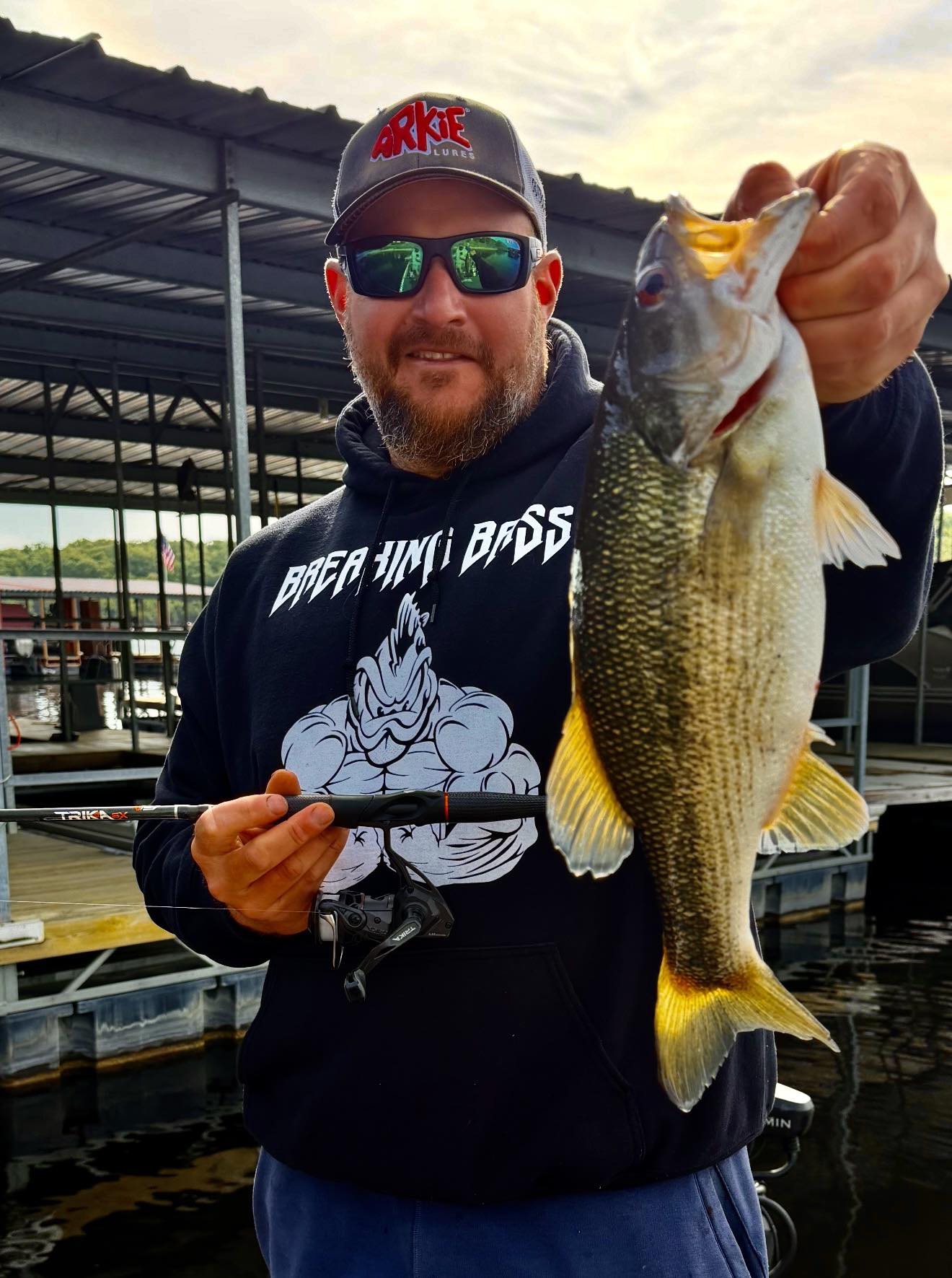 Spotted bass fishing catch in Branson Missouri marina dock
