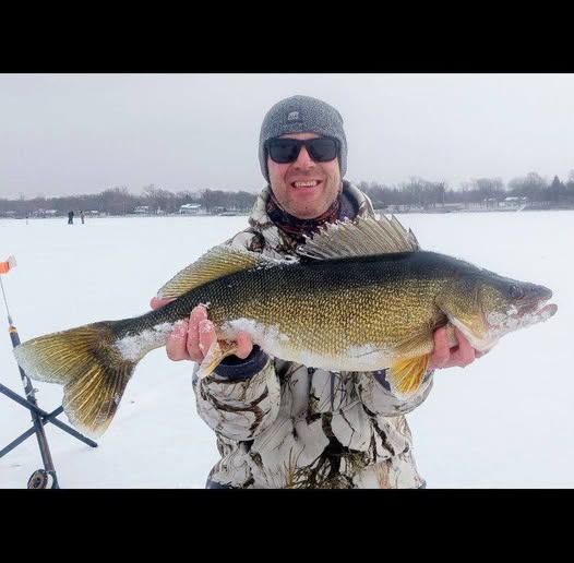 Ice fishing catch of walleye in Altmar NY winter scene