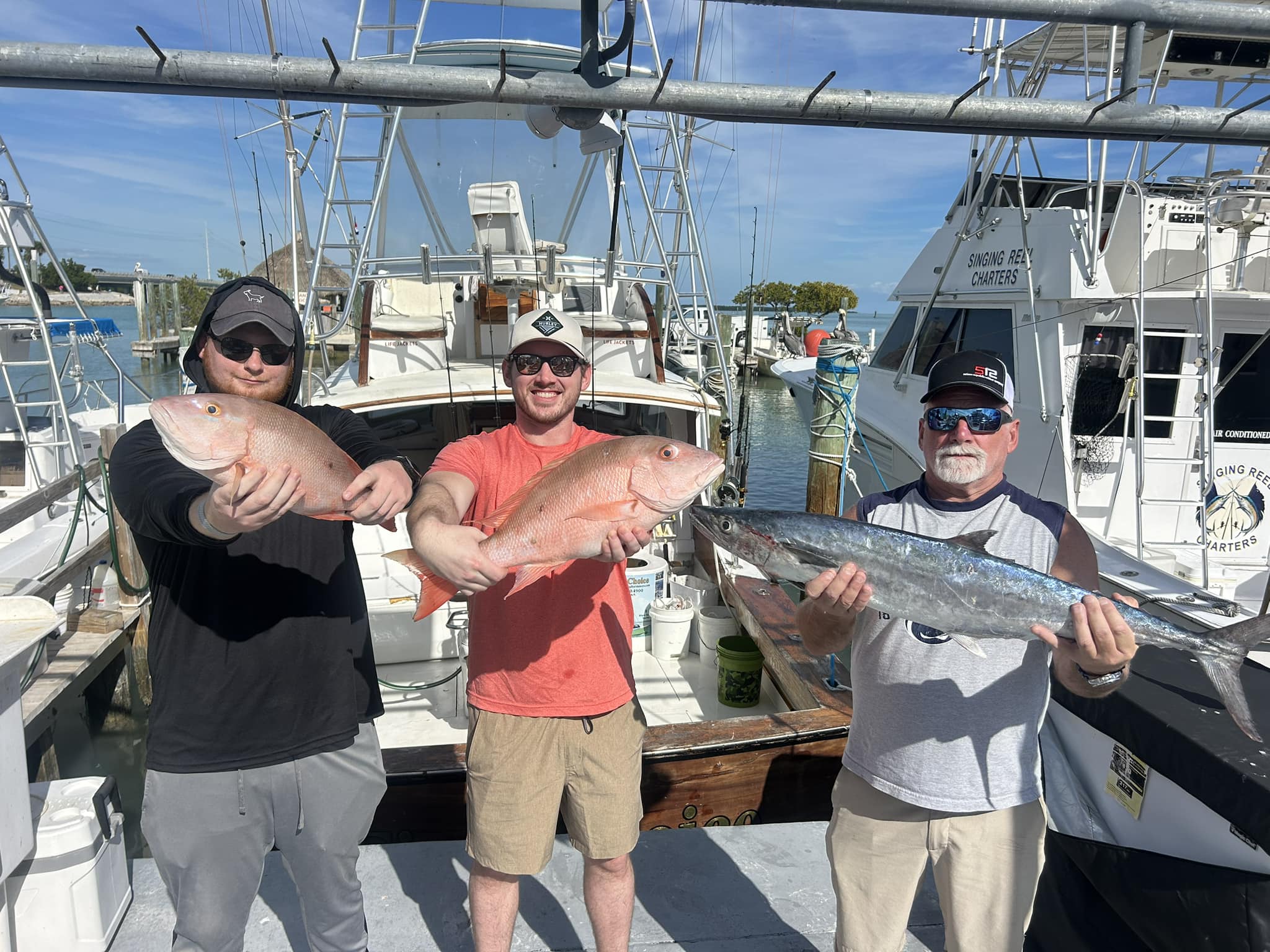 Three mutton snapper fish, 23 inches long, caught while fishing in Islamorada