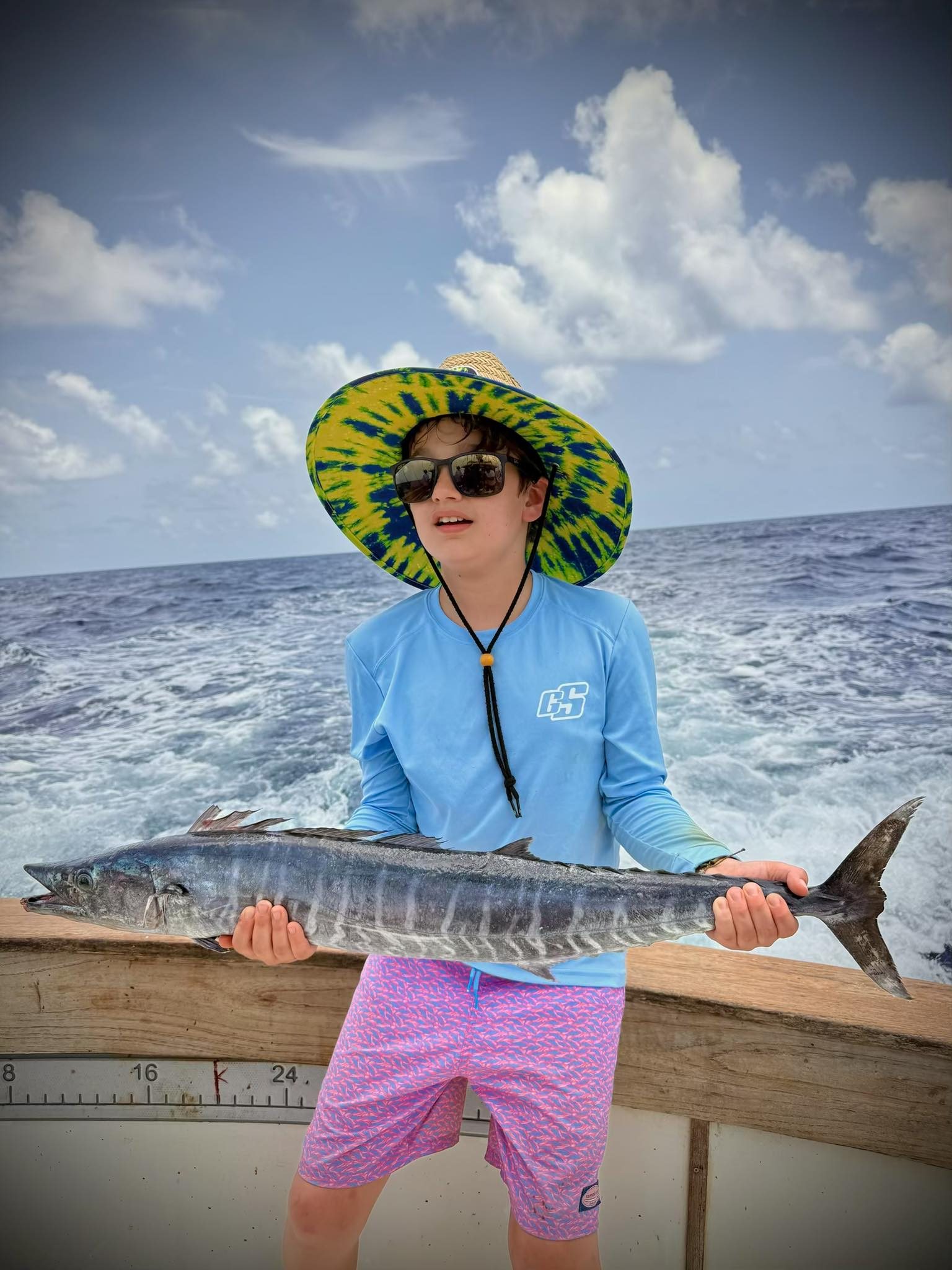 A fisherman catches a large wahoo fish in Islamorada