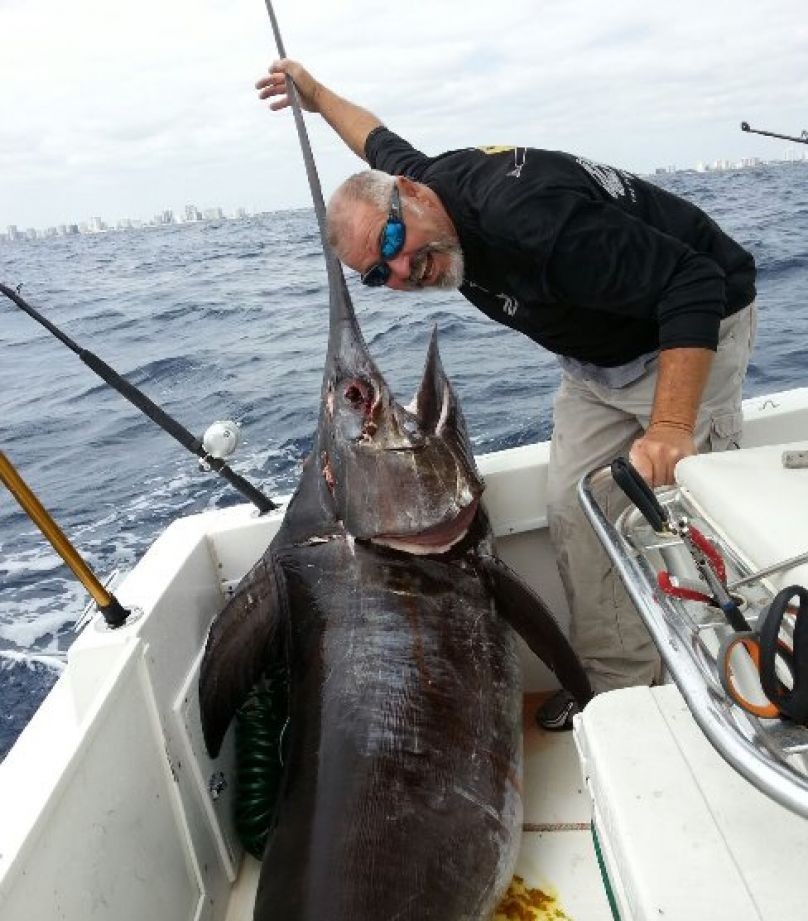 Swordfish fishing charter boat in Pompano Beach waters with Captain Tom and anglers