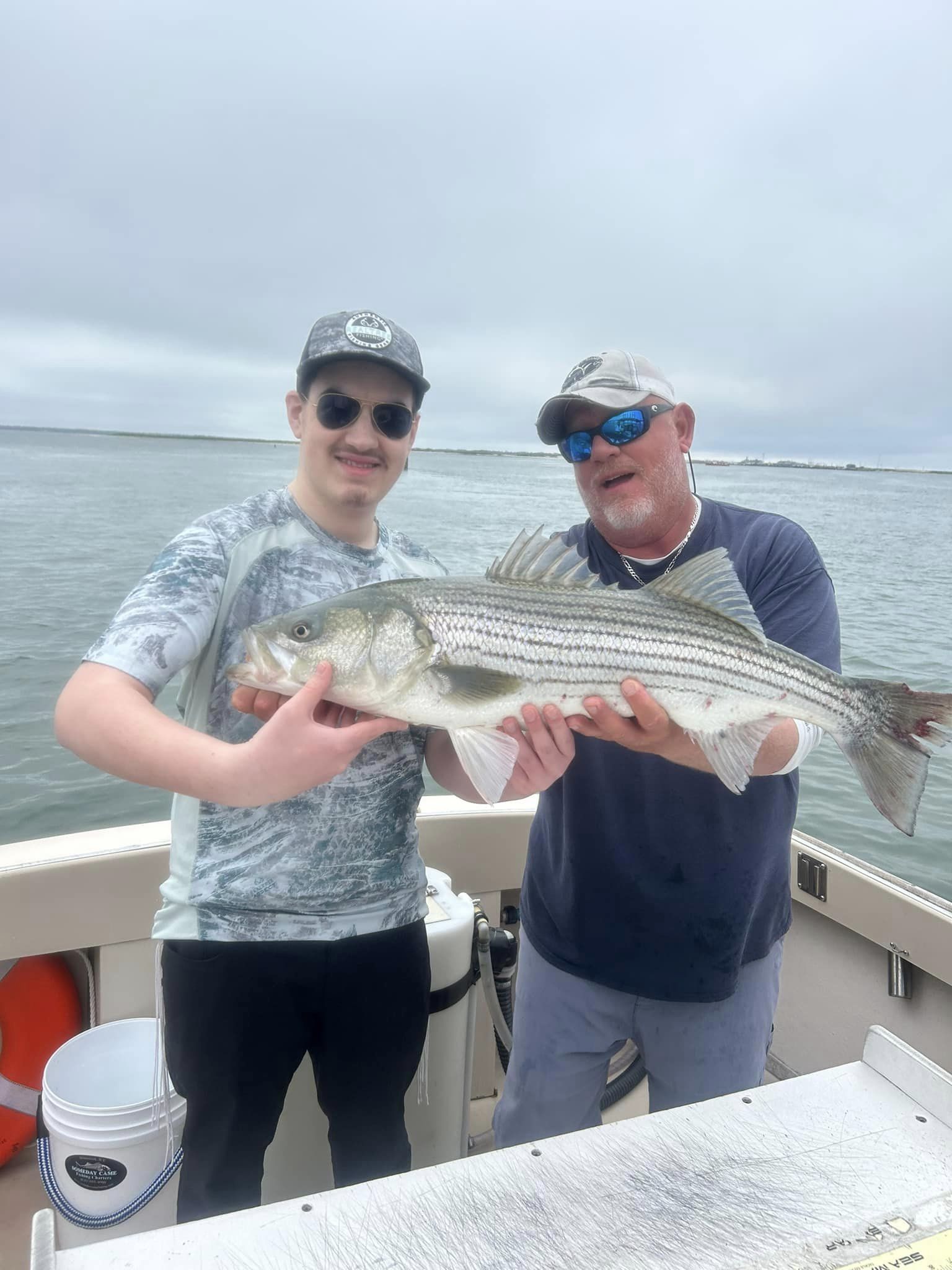 Striped bass caught by two people fishing in NY