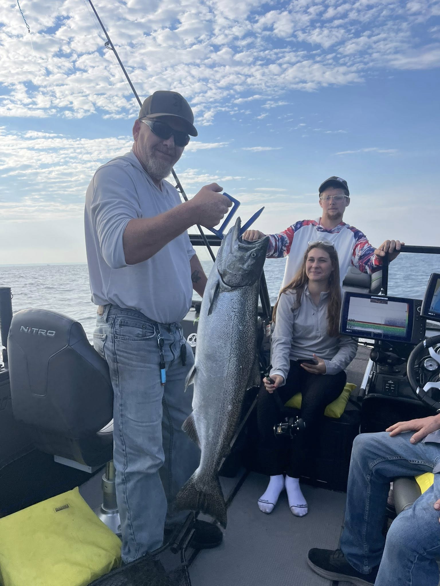 Large Chinook salmon caught during fishing trip in West Olive MI on boat