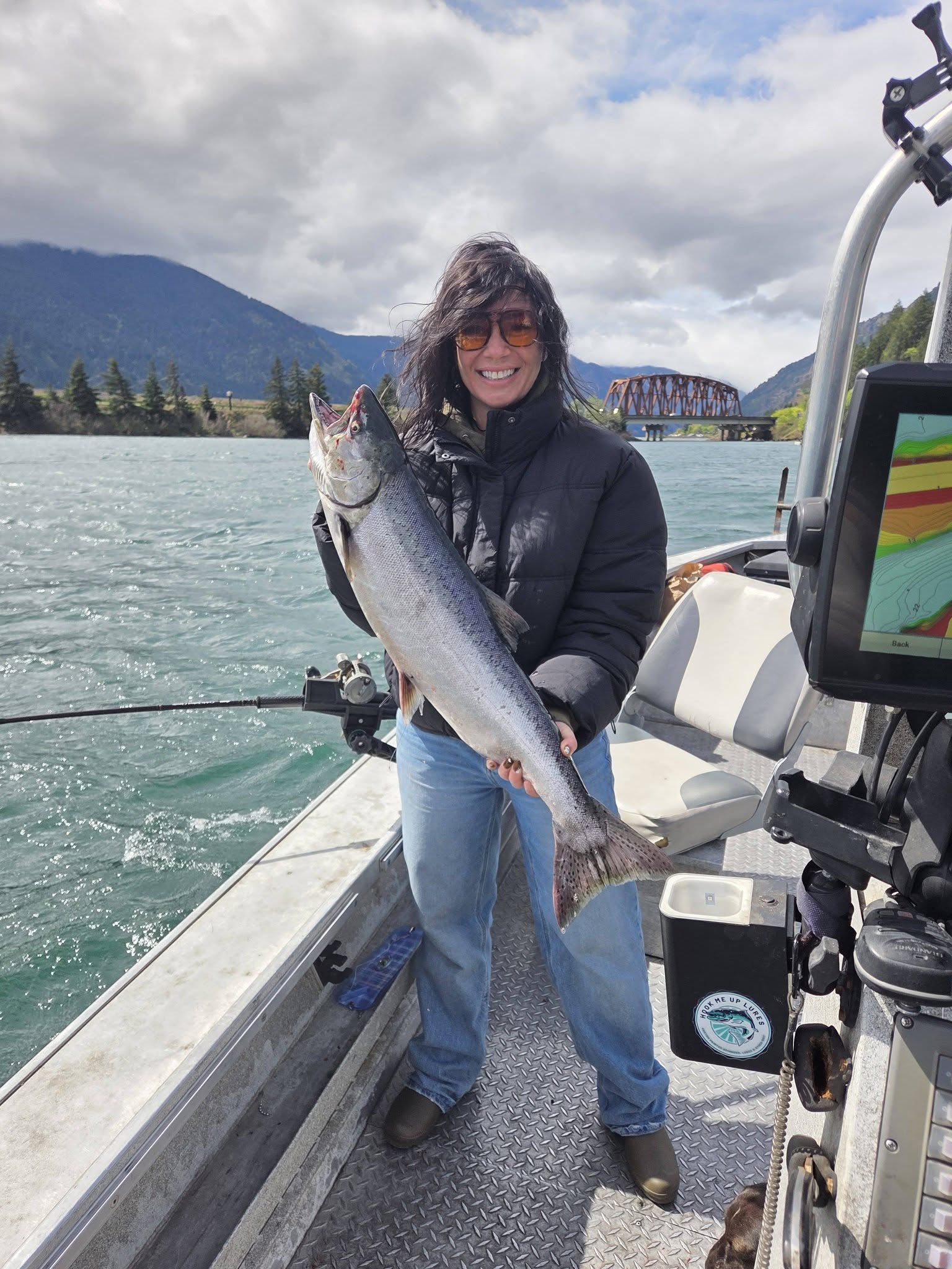 Chinook salmon catch on fishing boat in Dayton WA waters with mountains and bridge in background