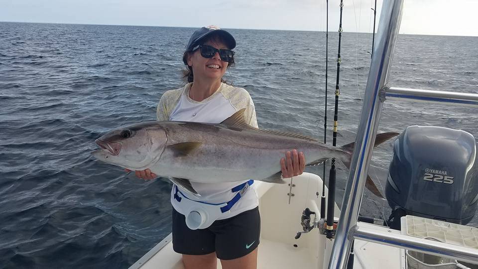 Angler holding a large fish in Destin