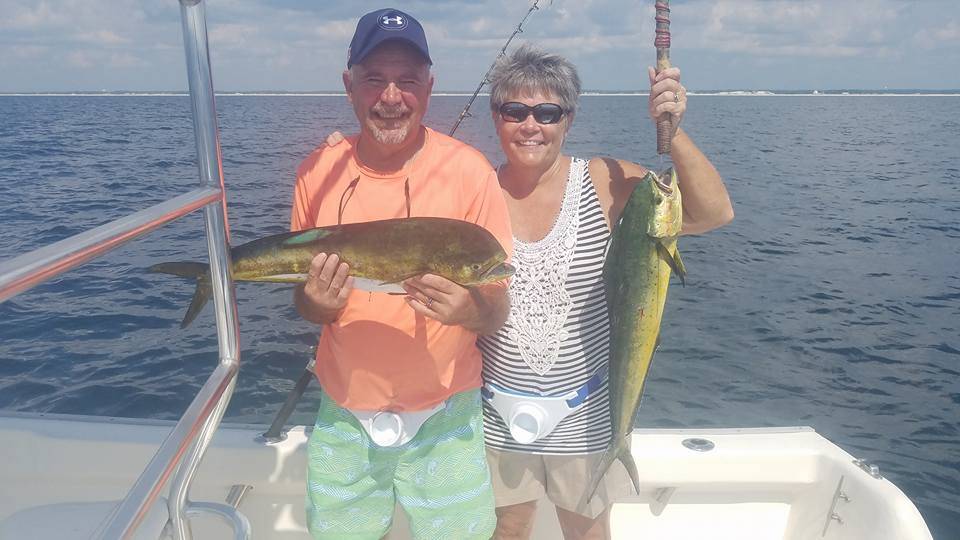 Two anglers catch fish in Destin
