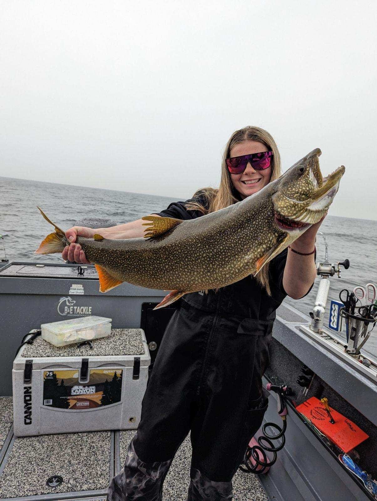 Angler fishing with rod and reel in Manistee