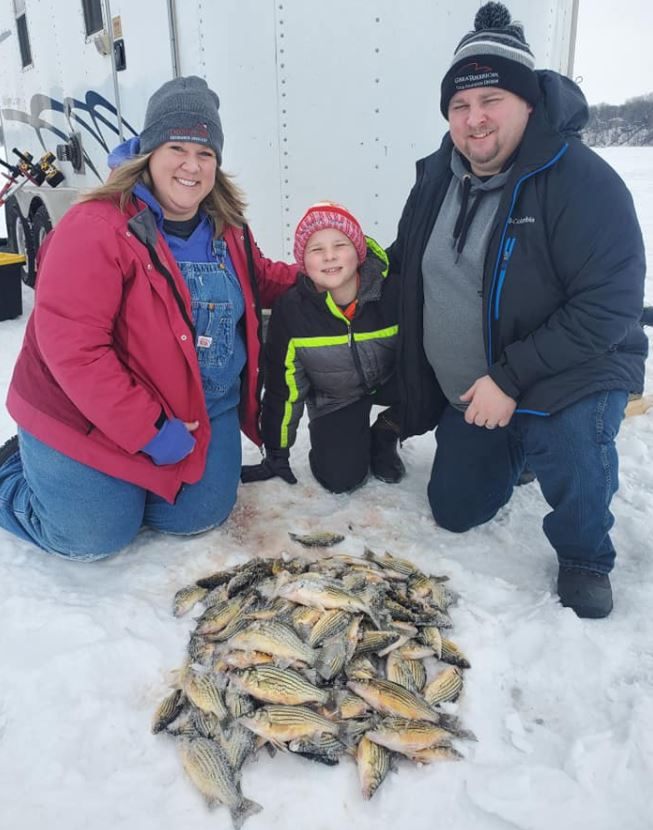Three people enjoying fishing in IA