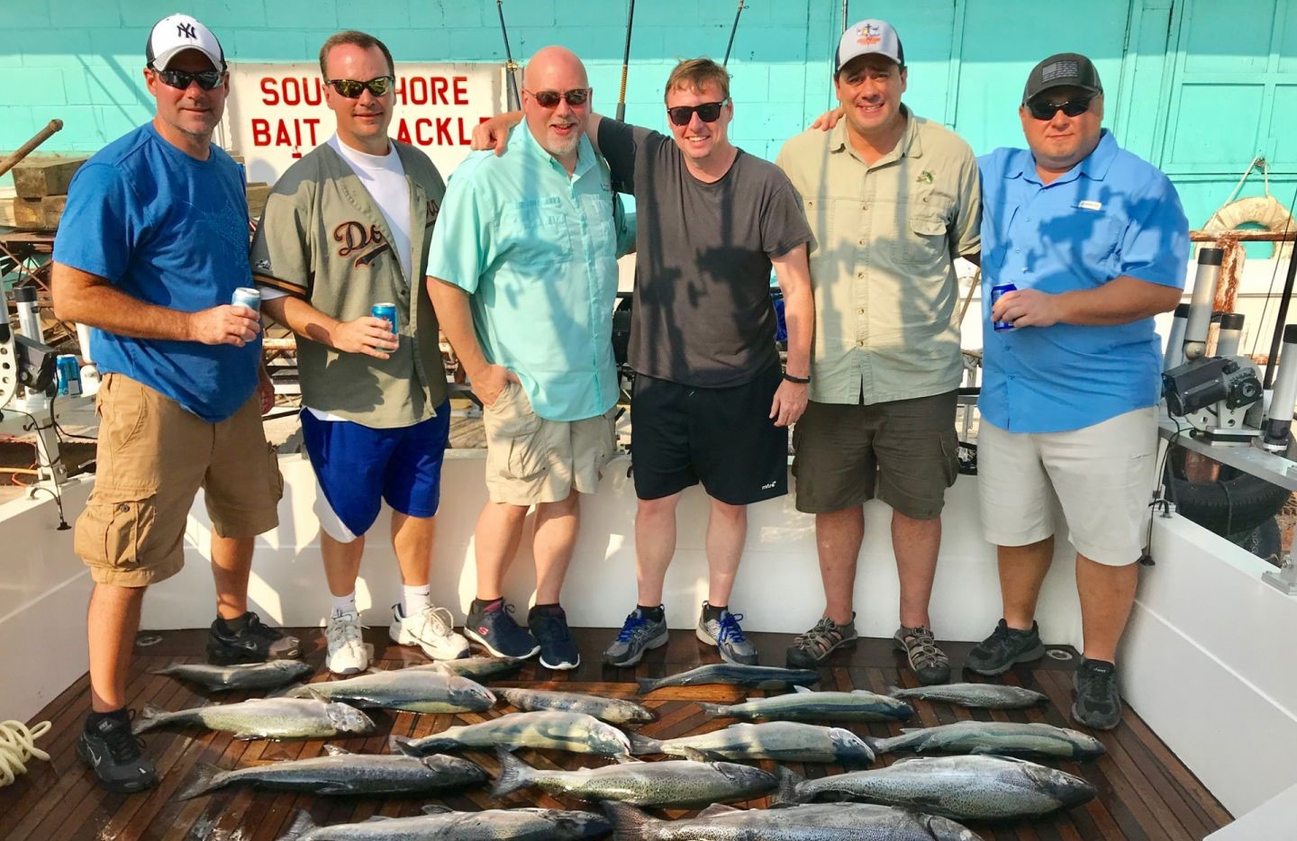 Fishing charter catch displayed on boat deck in Burt NY with multiple fish laid out