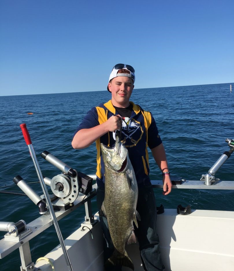 Large Chinook salmon caught while fishing in Burt NY on boat with downrigger equipment