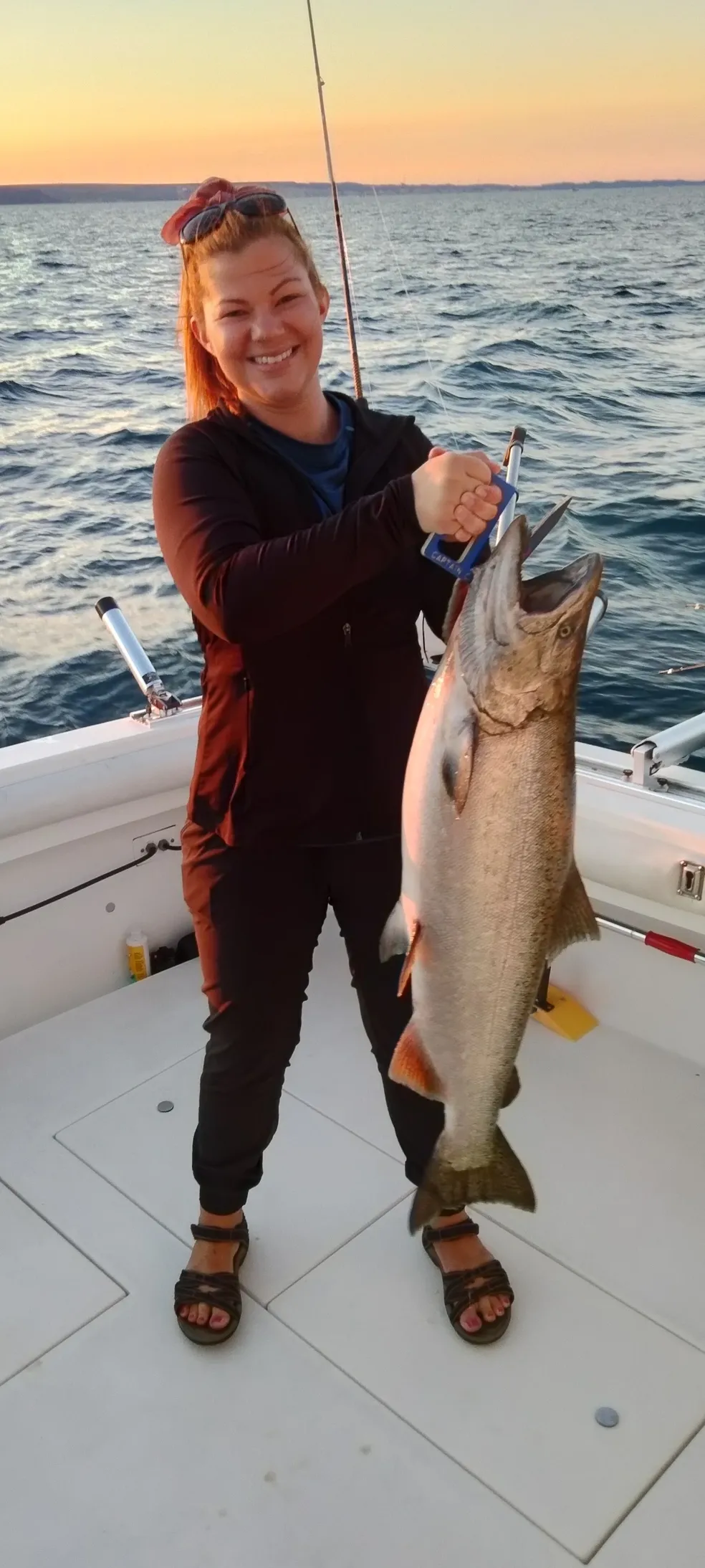 A fisherman holds a beautiful rainbow trout caught in Ludington.
