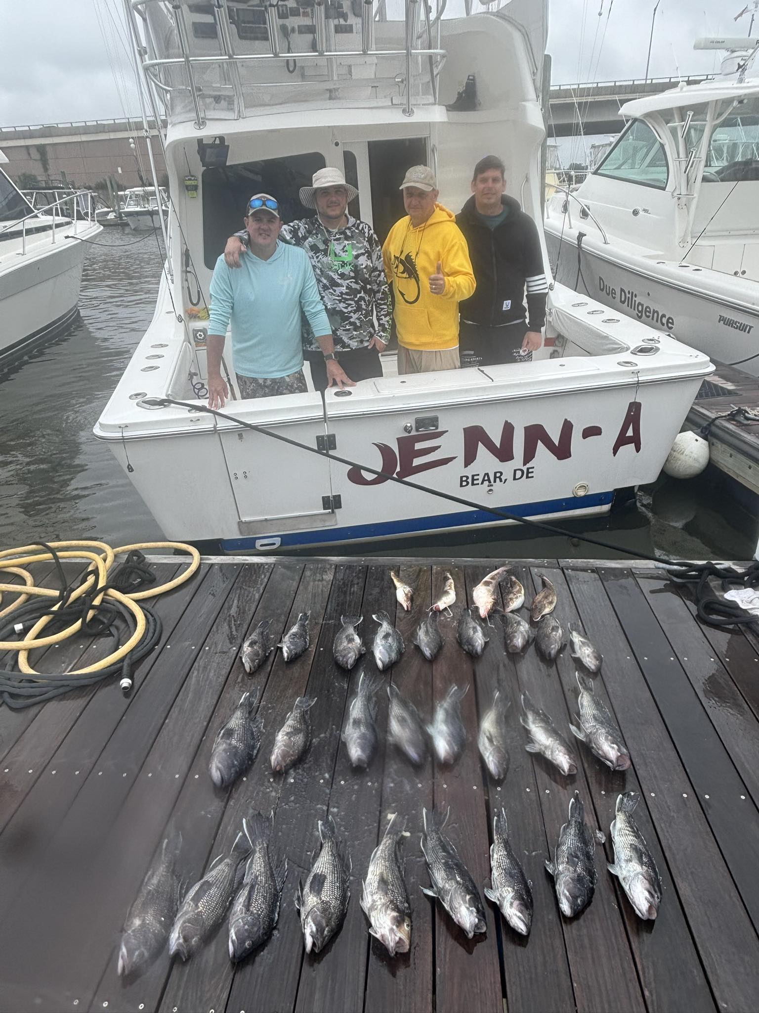 Four people enjoying a fishing cruise in NJ