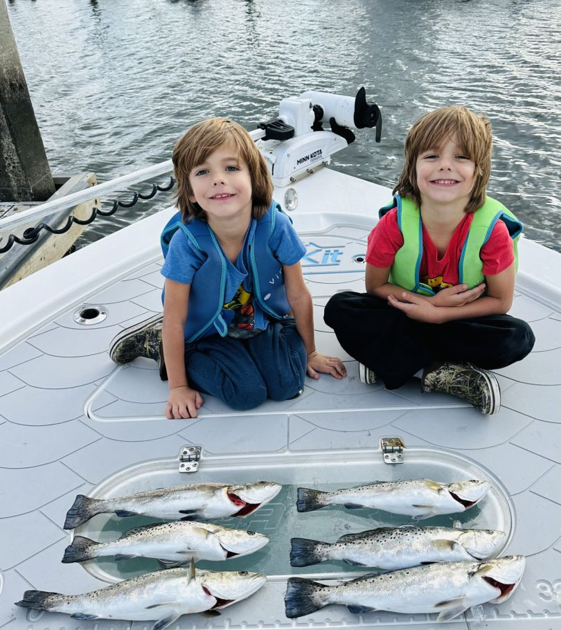 Two people fishing with 6 spotted weakfish in Savannah