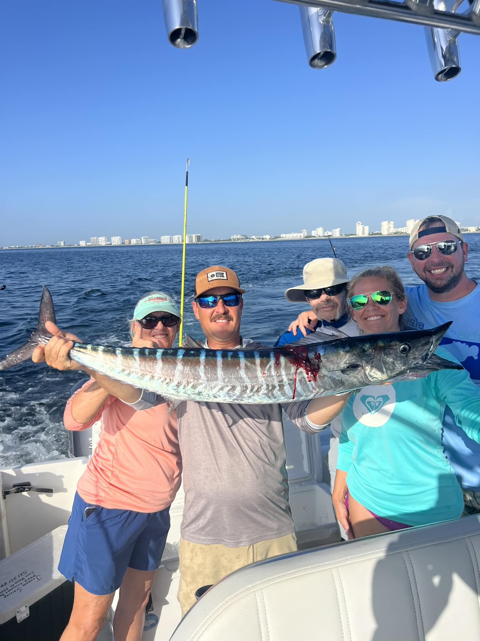 A group of 5 people fishing in Delray Beach