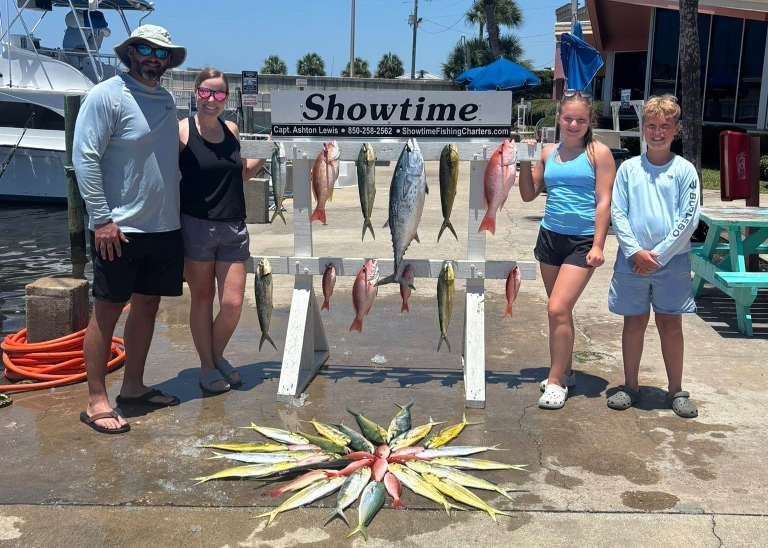 Fishing charter display showing caught Little Tunny, Mahi Mahi, and Red Snapper from Panama City Beach FL