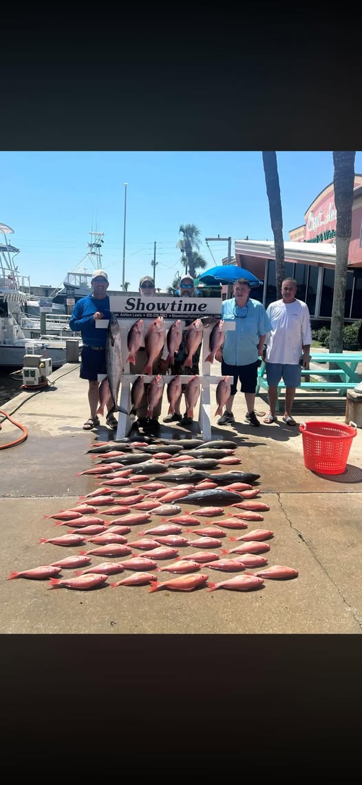 Successful fishing trip displaying large catch of red snapper laid out on Panama City Beach FL dock
