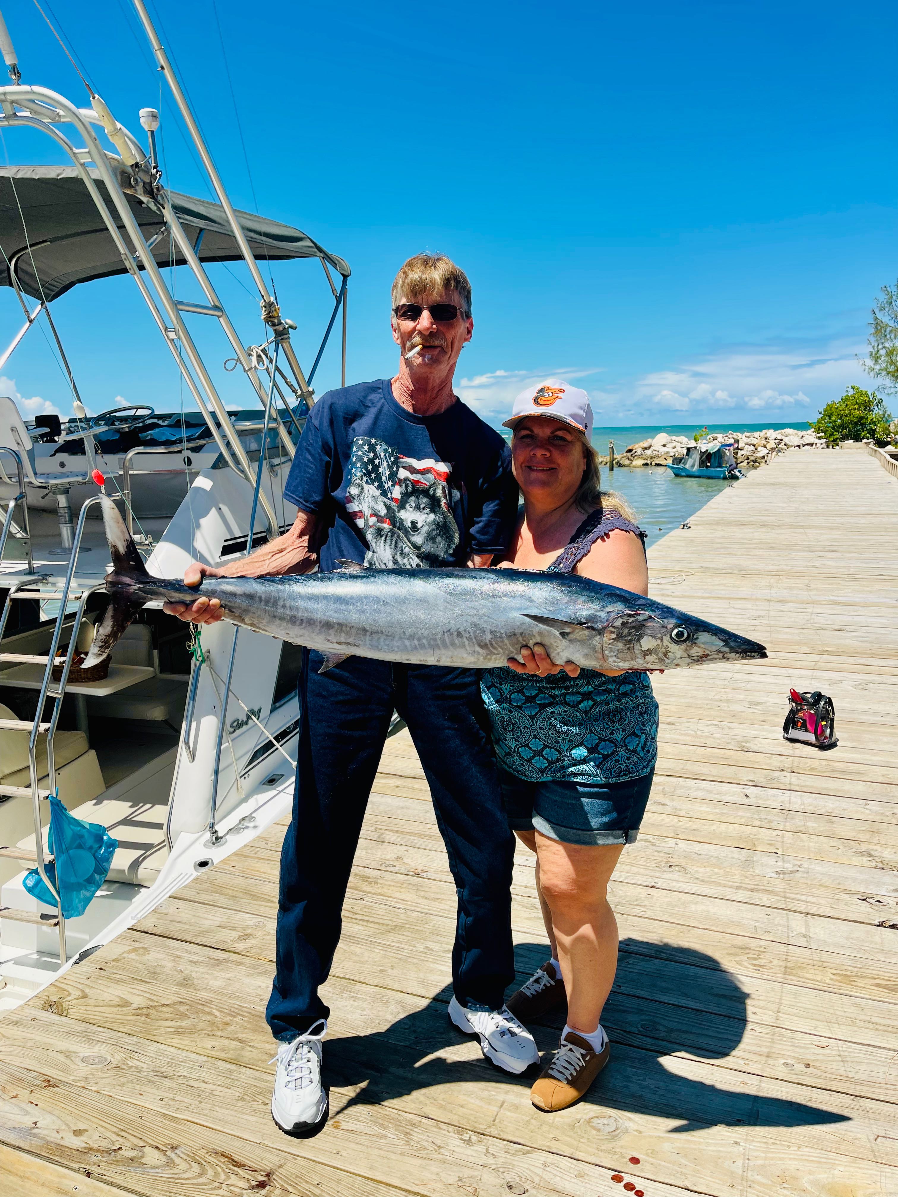 King mackerel fishing catch displayed on dock in Puerto Plata