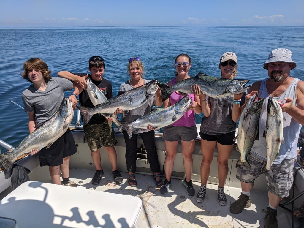 6 fishing enthusiasts enjoying a day at Wolcott