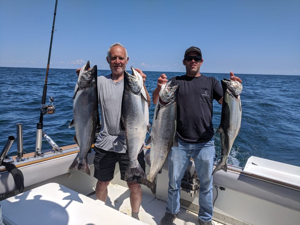 Four huge Great Barracuda, Chinook Salmon, and Coho Salmon caught while fishing in Wolcott