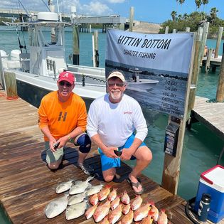 Two people fishing at Fort Pierce