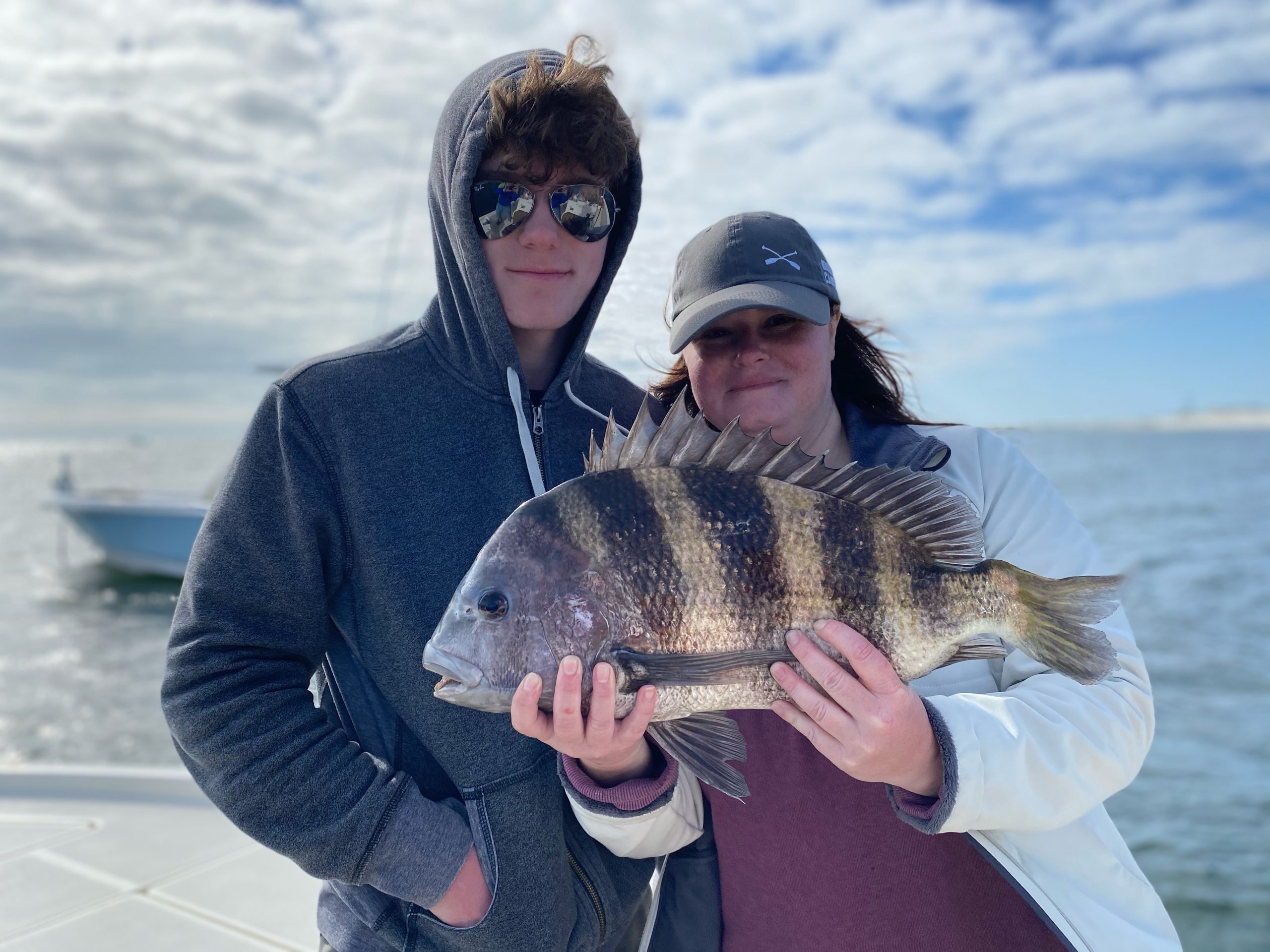 Sheepshead fish caught by two people fishing in FL