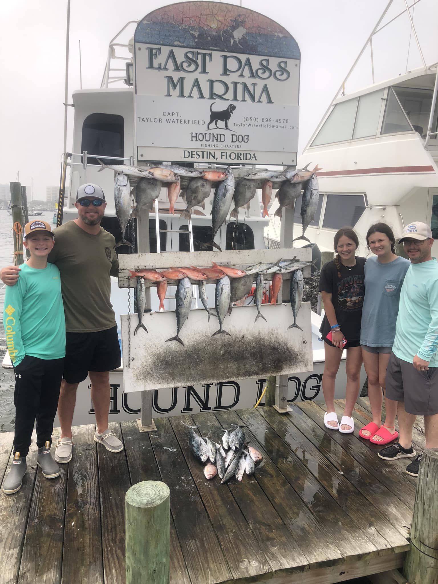 Two little tunny fish caught by five people fishing in Florida