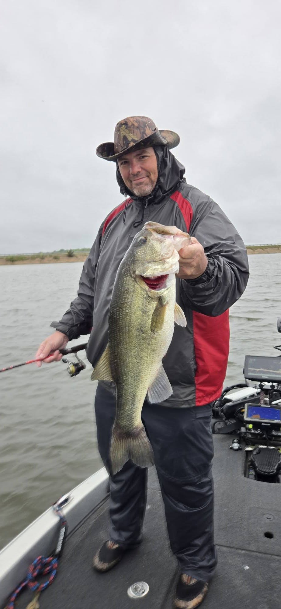Large bass caught while fishing in Quitman TX displayed on boat