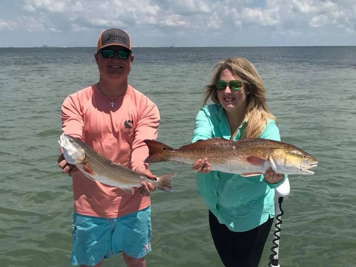 Two redfish, 24 inches long, caught while fishing in TX