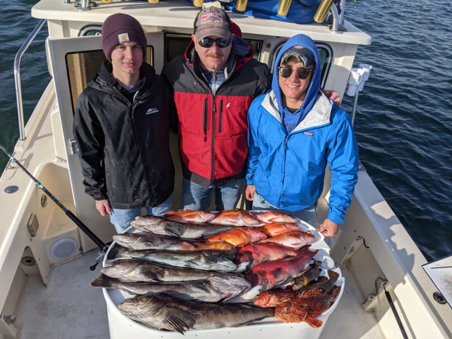 3 people enjoying a fishing trip in San Diego