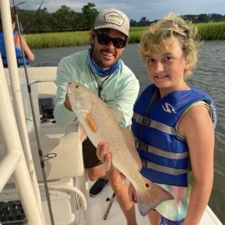 Two people fishing with one large fish caught in GA