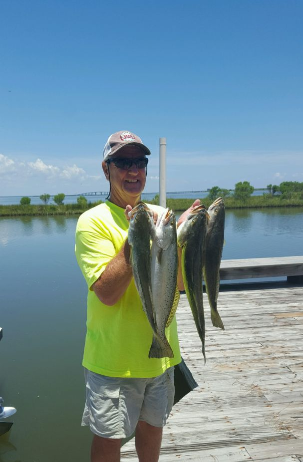 A person fishing with two small fish in St. Augustine